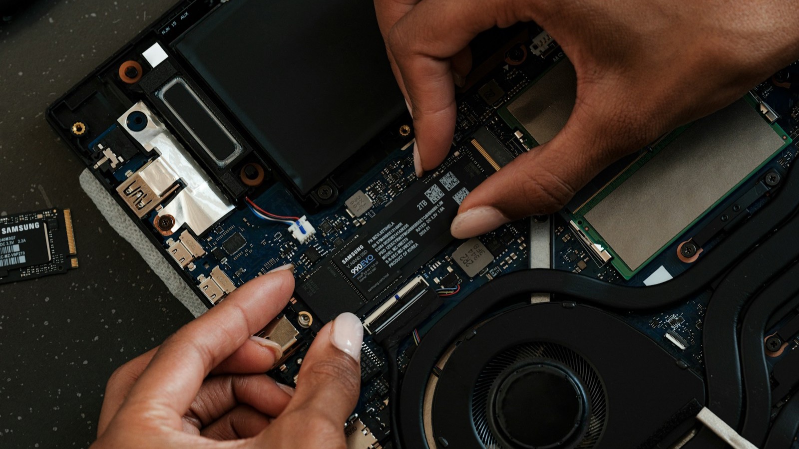 Laptop repair technician at work
